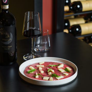Carpaccio di Black Angus affumicato con parmigiano vacche rosse